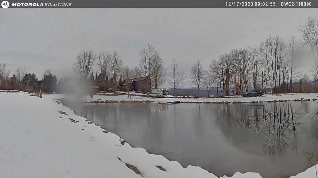 Body cam image provided by the Vermont State Police shows a pond just after a Vermont State Police trooper rescued a girl who had fallen through thin ice