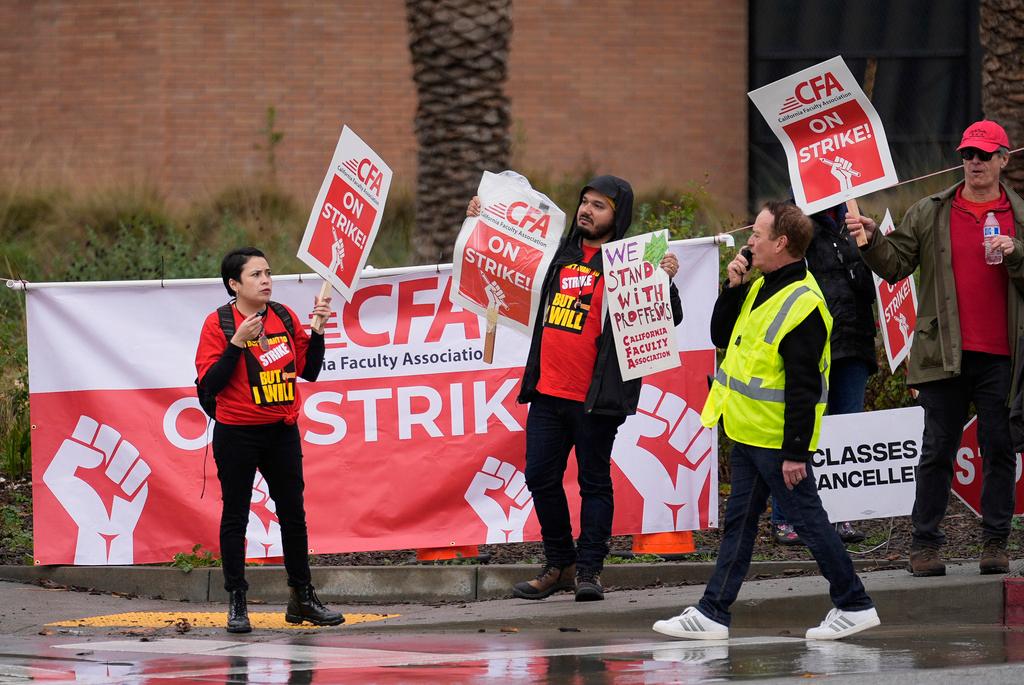 Demonstrators picked and shout slogans outside the Cal State Northridge campus Sunday, Jan. 21, 2024, in Northridge, Calif.