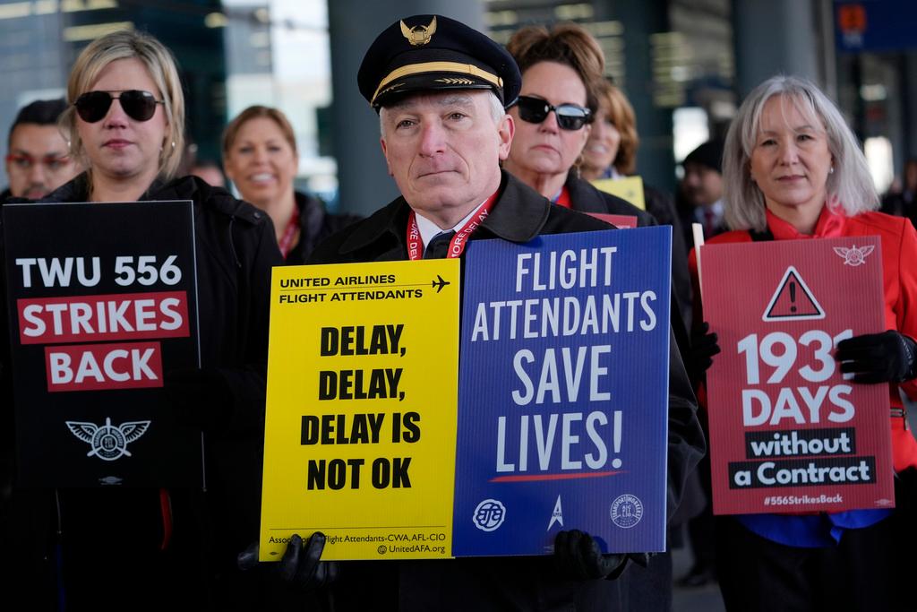 Flight attendants and a pilot protest at O'Hare International Airport in Chicago