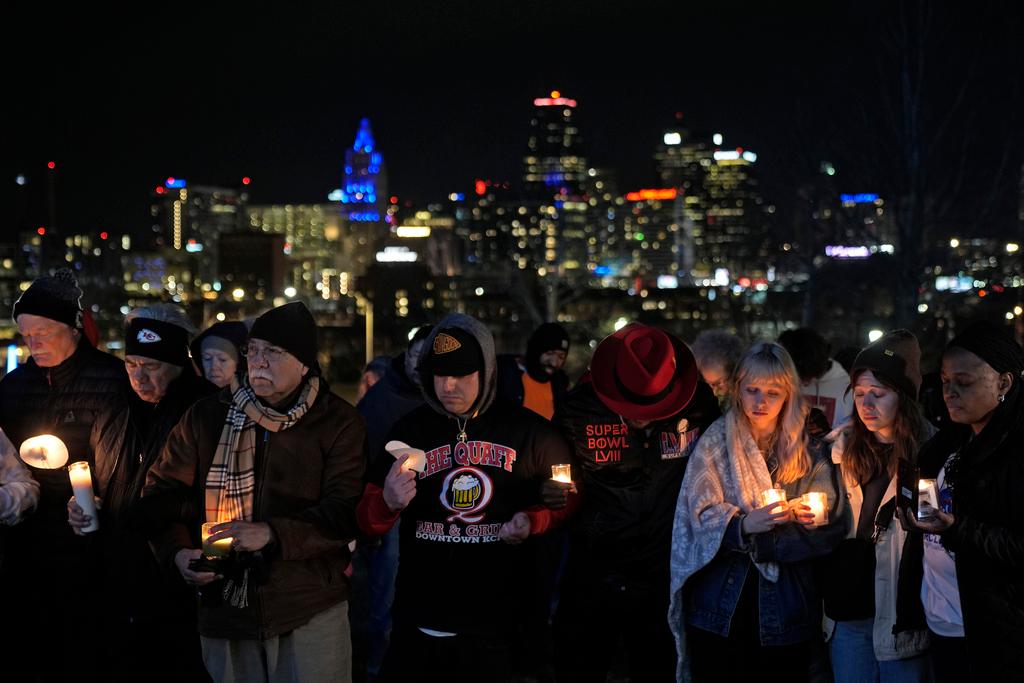 People attend a candlelight vigil for victims 