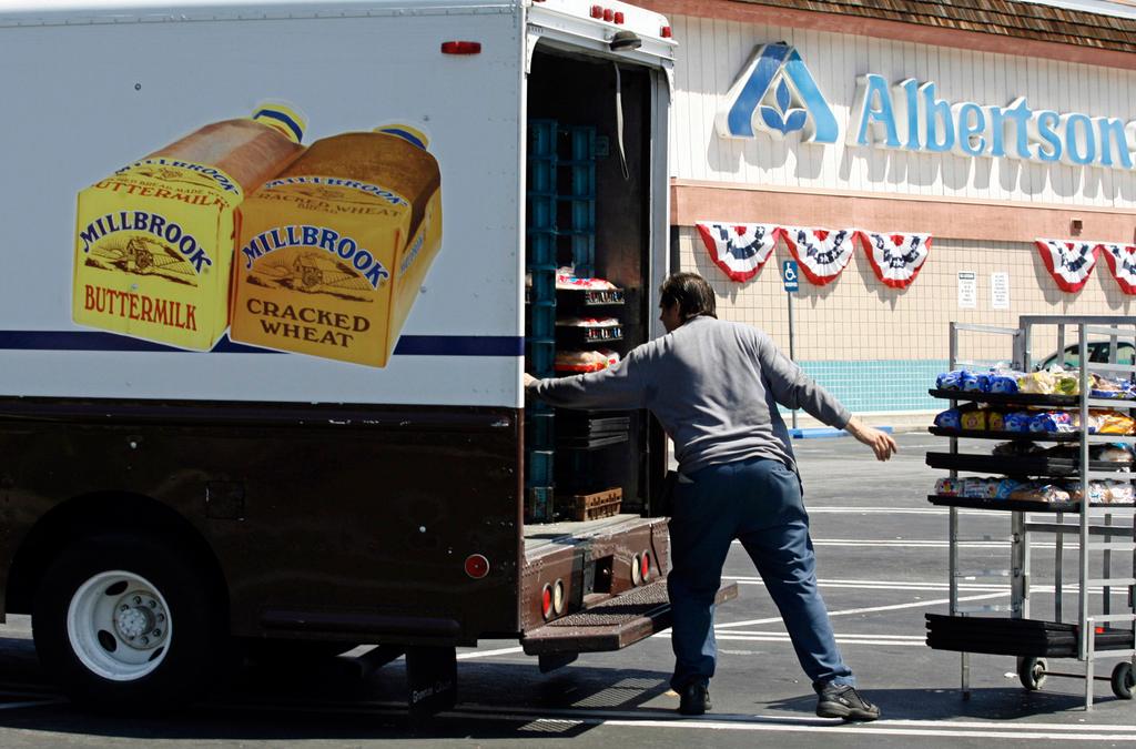 Mitch Maddox, a bread route salesman, loads bread outside the Eagle Rock Albertsons store in Los Angeles