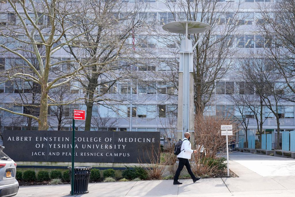 Person walks outside of Albert Einstein College of Medicine in the Bronx, NY