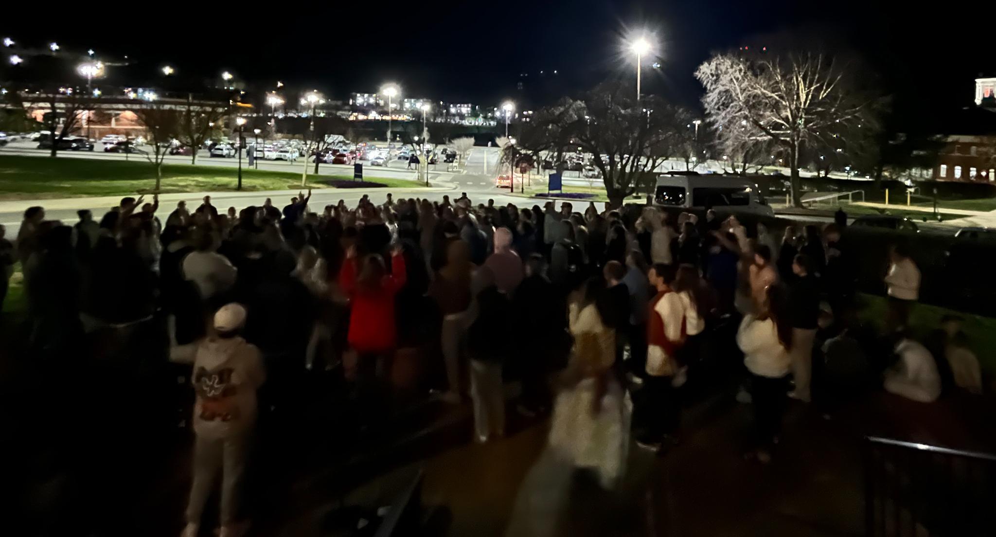 Students outside of chapel, worshipping in 30 degree weather.