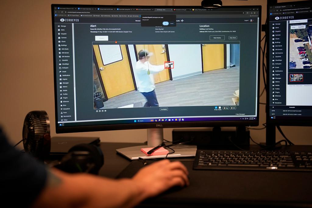 ZeroEyes analyst Mario Hernandez demonstrates the use of artificial intelligence with surveillance cameras to identify visible guns at the company's operations center in Conshohocken, Pa. 