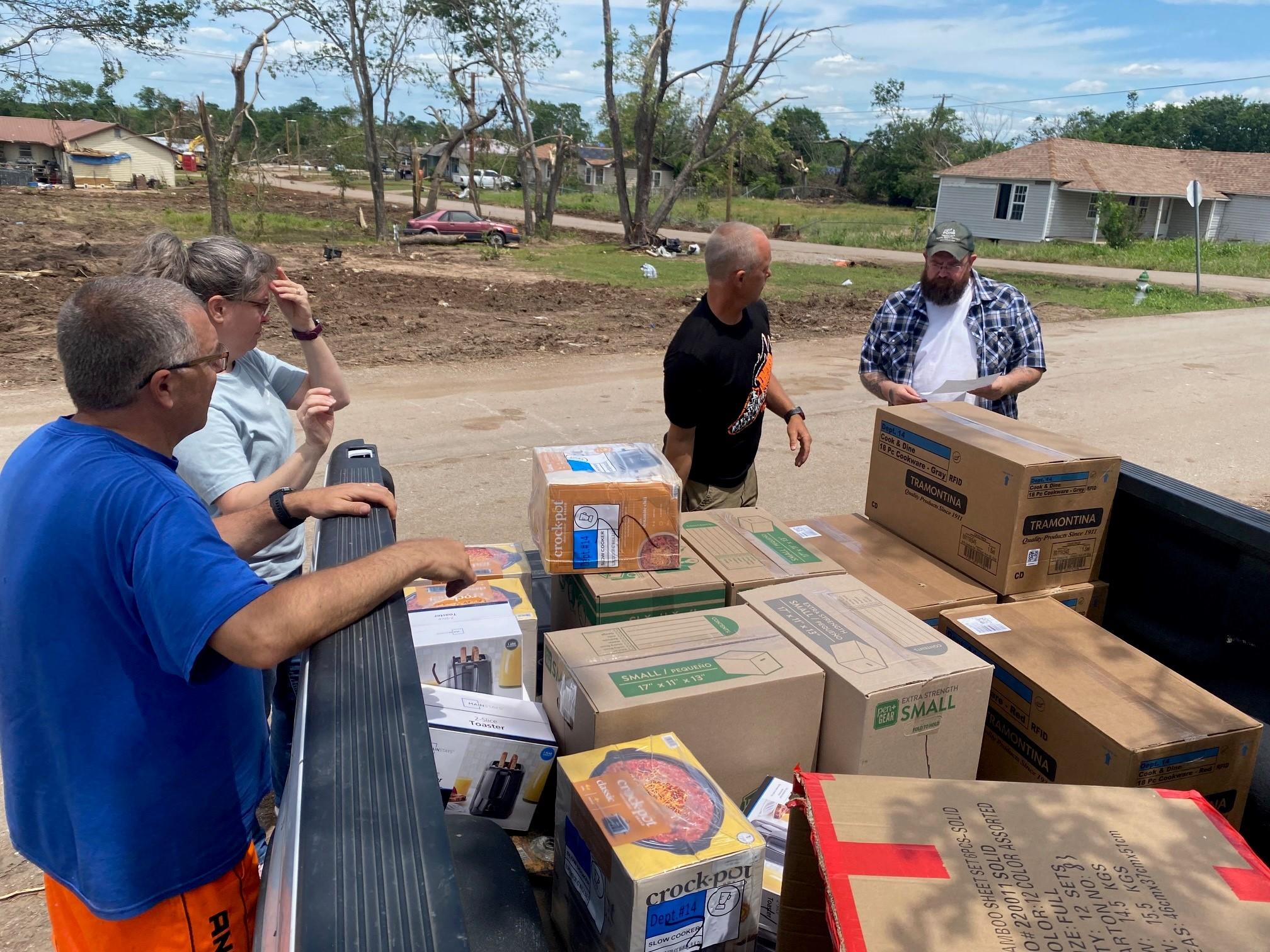 David and Krista Lewis sharing a Kitchen Kit and other supplies