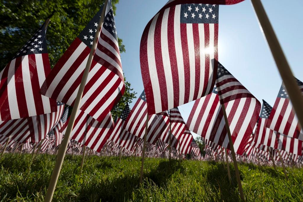  The sun shines through the flags in the Memorial Day Flag Garden on Boston Common