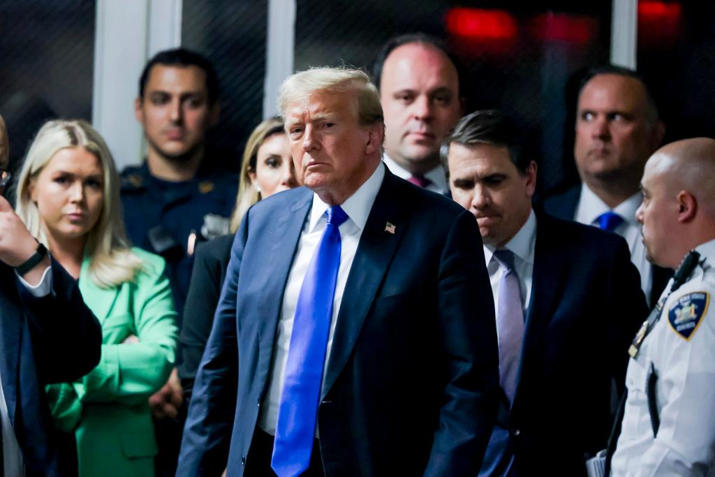 Former President Donald Trump leaves the courthouse after a jury found him guilty of all 34 felony counts 