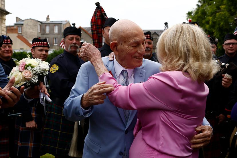 US WWII veteran Harold Terens, 100, left, and Jeanne Swerlin, 96, arrive to celebrate their wedding at the town hall of Carentan-les-Marais, in Normandy