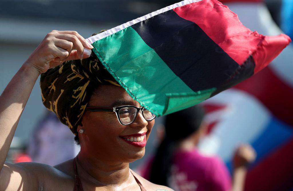 Woman waves Pan-African flag