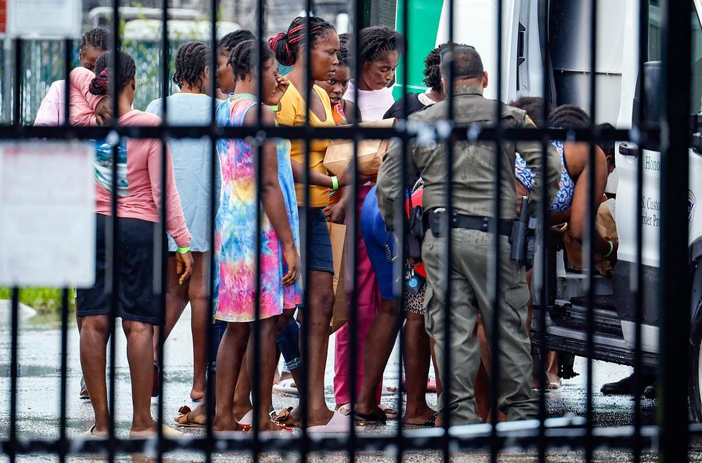 Migrants prepare to depart the U.S. Customs and Border Protection - Marathon Border Patrol Station in Marathon, Fla. on Wednesday, June 26, 2024. A group of more than 100 migrants from Haiti arrived off Key West in a sailboat early Wednesday