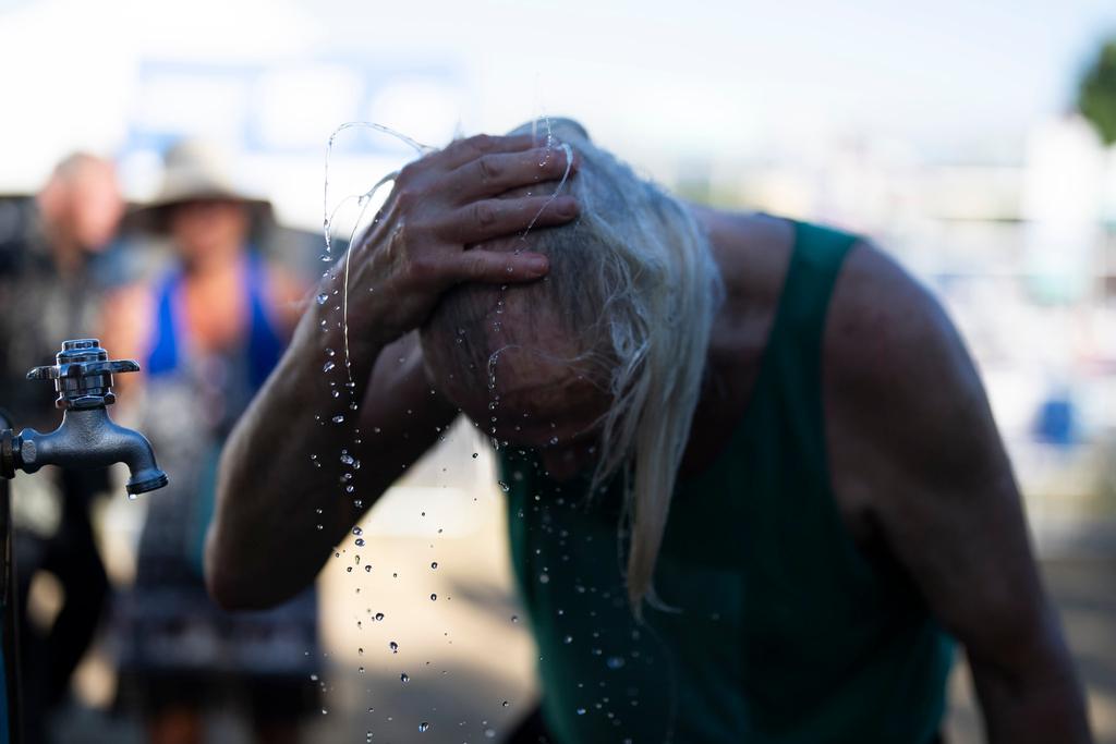 A person cools off during the Waterfront Blues Festival in Portland, Ore. 