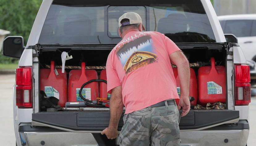 Steve Pete filled up gas containers to give to neighbors and the elderly if they need it ahead of Tropical Storm Francine in Violet, La. 