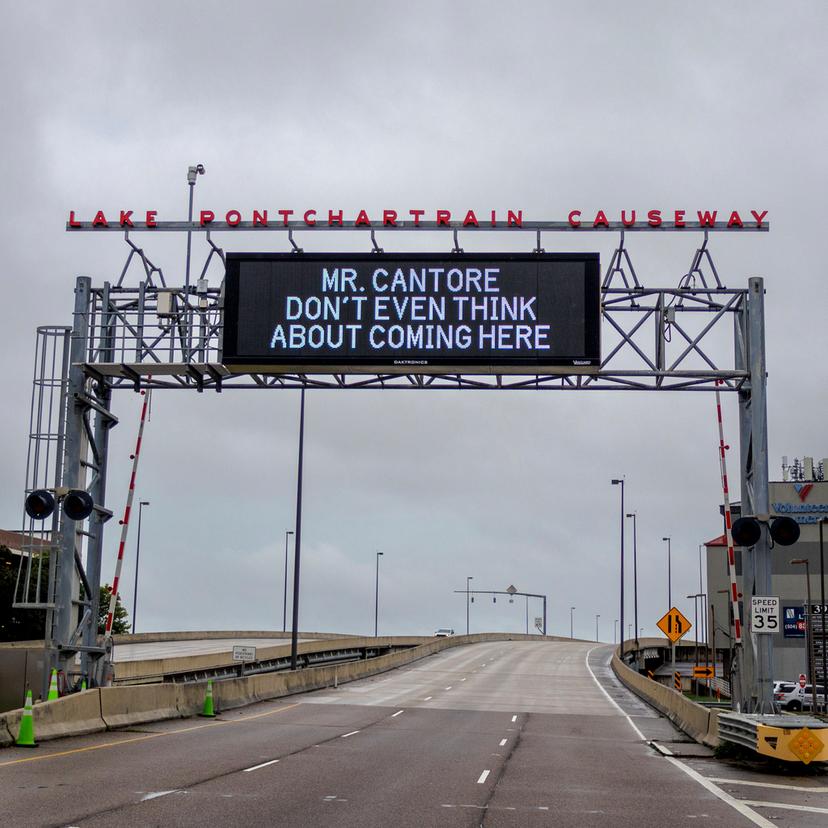 A message aimed at The Weather Channel's meteorologist Jim Cantore is displayed on the message board at the Lake Pontchartrain Causeway near New Orleans as the region prepares for Tropical Storm Francine