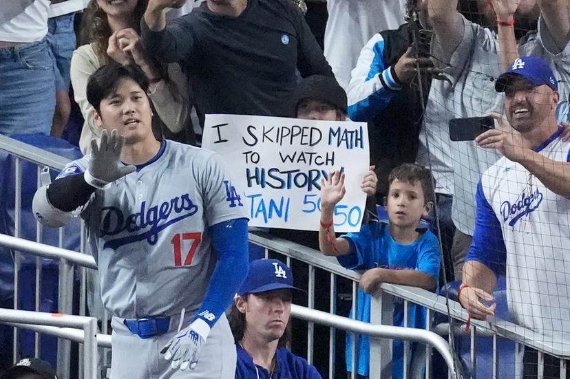 Los Angeles Dodgers' Shohei Ohtani (17) waves to fans after he hit a home run scoring Andy Pages, during the seventh inning of a baseball game against the Miami Marlins