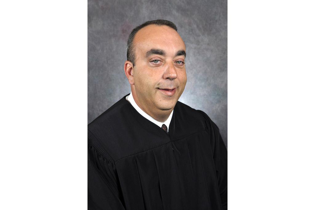 This undated photo provided by Kentucky Court of Justice shows slain District Judge Kevin Mullins.