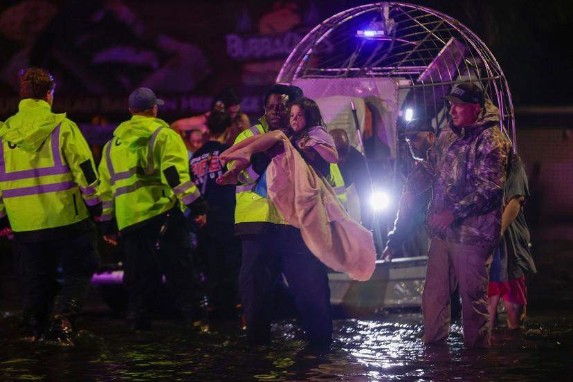 An airboat transports residents rescued from floodwaters in the aftermath of Hurricane Helene in Crystal River, Fla.