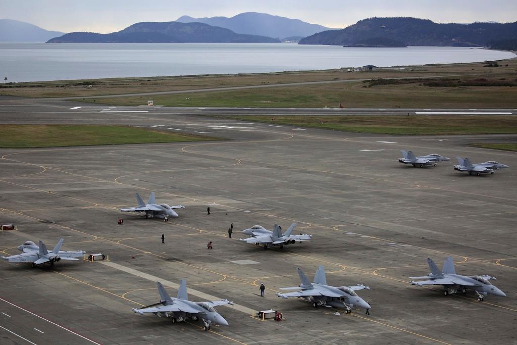 EA-18G Growlers, with some of San Juan Islands in the background, prepare for an exercise at Naval Air Station Whidbey Island