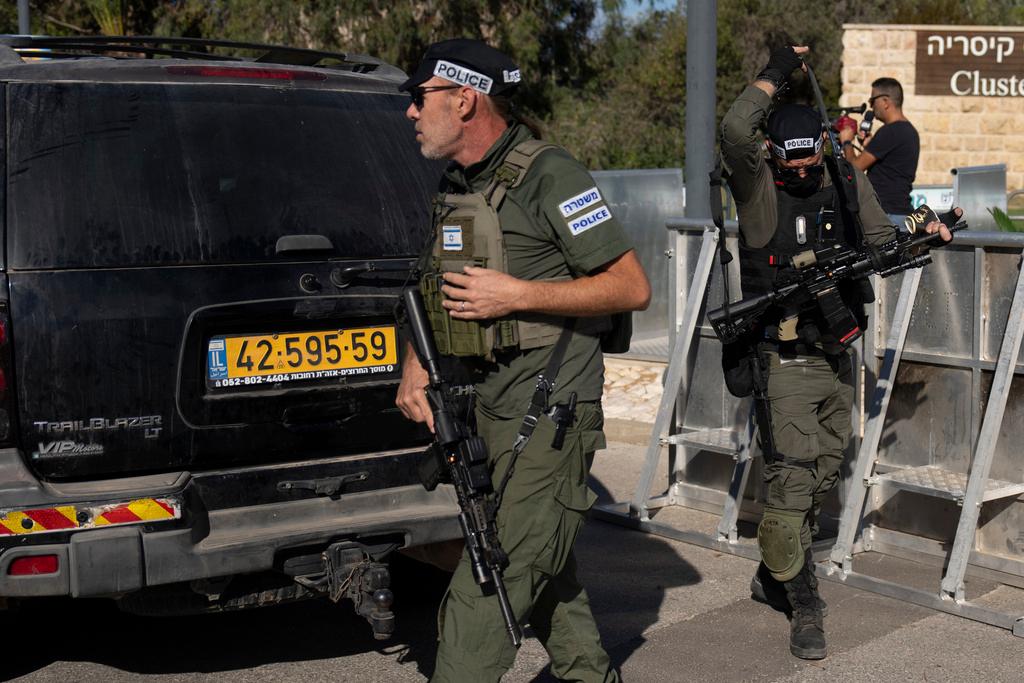 Israeli security forces secure a road near where Israel's government says a drone launched toward Israeli Prime Minister Benjamin Netanyahu's house in Caesarea, Israel 