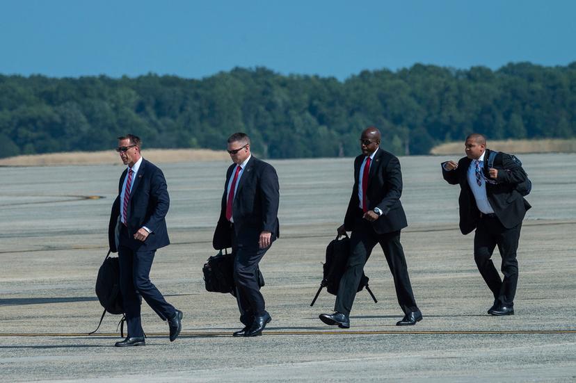 Members of President Joe Biden's Secret Service detail walk to Air Force One at Andrews Air Force Base