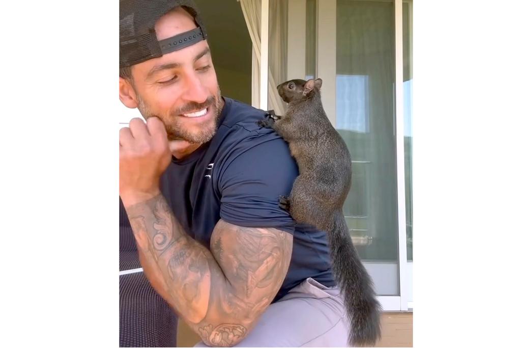 Mark Longo shows him with his pet squirrel Peanut that was seized by officers from the state Department of Environmental Conservation, at Longo's home in rural Pine City, N.Y.