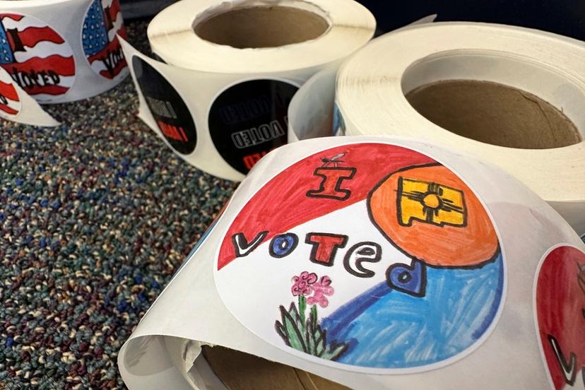 Rolls of I Voted stickers that were designed by students as part of a contest are stacked at an early voting center in Albuquerque, N.M., on Wednesday, Oct. 30, 2024. 