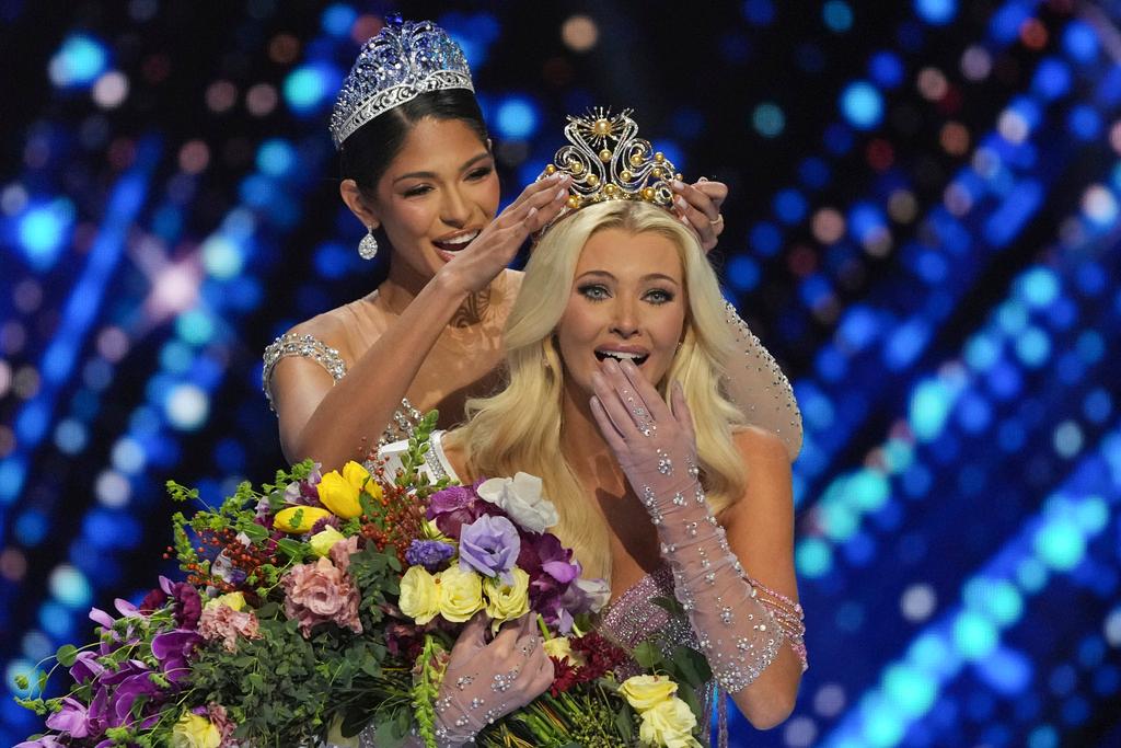 Miss Denmark Victoria Kjær Theilvig, right, receives the crown after winning the 73rd Miss Universe Beauty Pageant in Mexico City, Saturday, Nov. 16, 2024. 