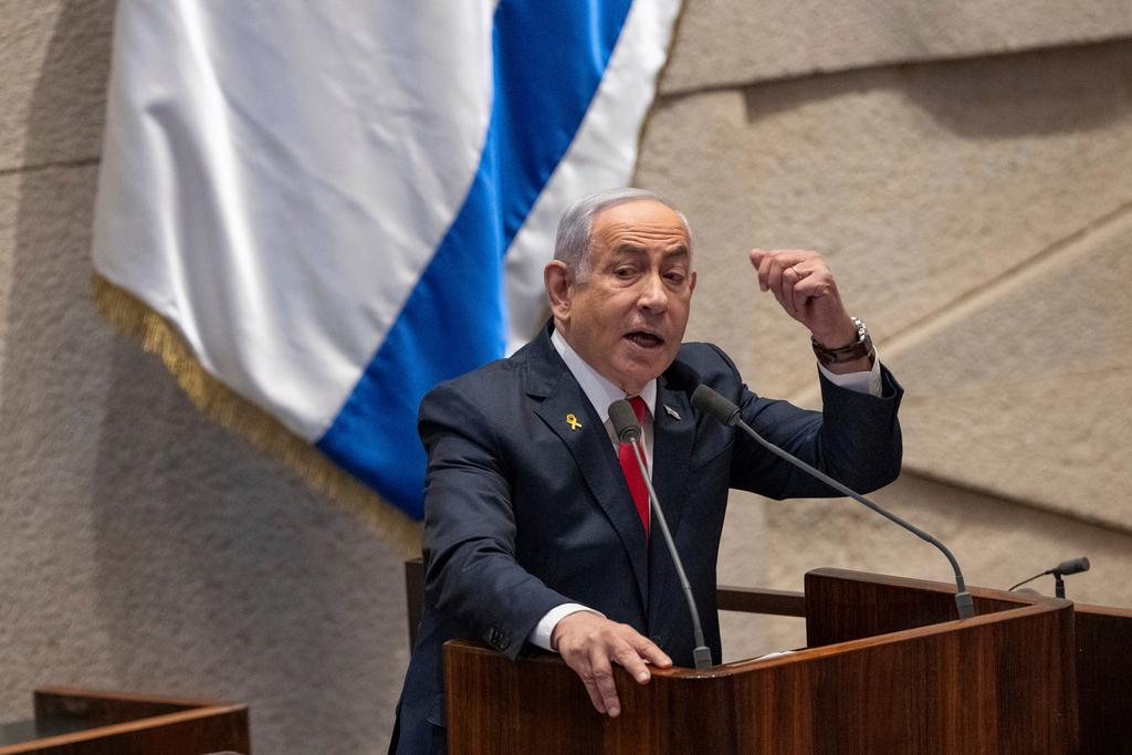 Israel's Prime Minister Benjamin Netanyahu addresses lawmakers in the Knesset, Israel's parliament, in Jerusalem. Monday Nov. 18, 2024. 