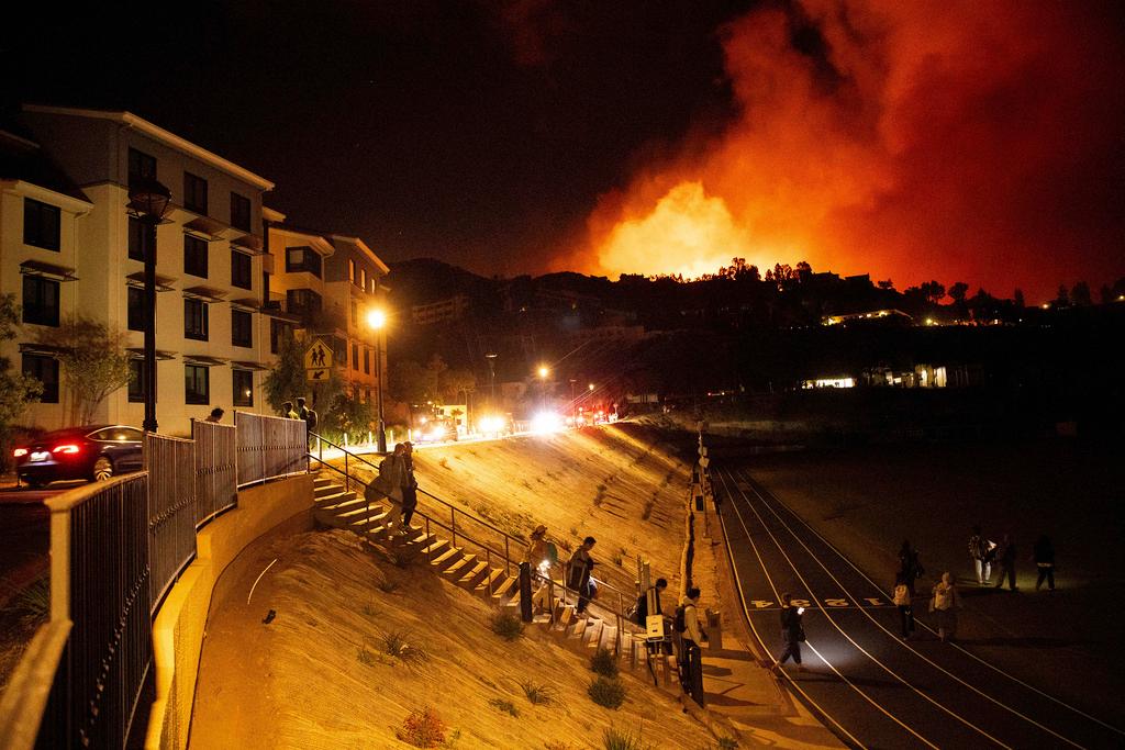 Students evacuate from Pepperdine University as the Franklin Fire burns in Malibu, Calif.