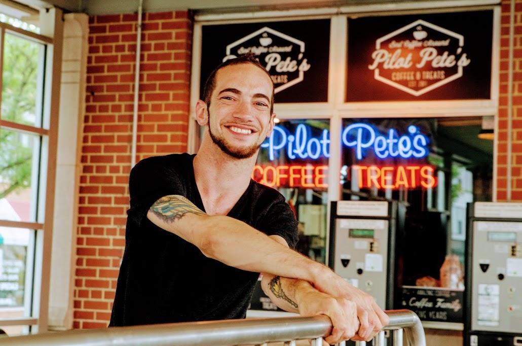 Peter Thomas in front of his storefront located in Elmhurst.