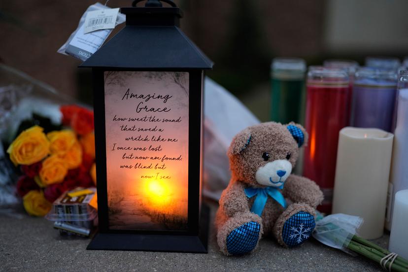 Flowers and candles are placed outside the Abundant Life Christian School