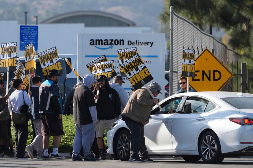 Amazon workers, on strike, picket outside an Amazon Fulfillment Center in City of Industry, Calif.