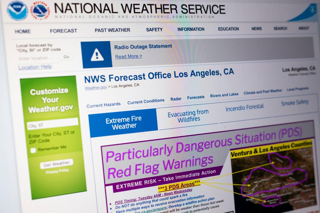 The National Weather Service's Los Angeles page screams “Particularly Dangerous Situation (PDS)” in hot pink letters against a gray background