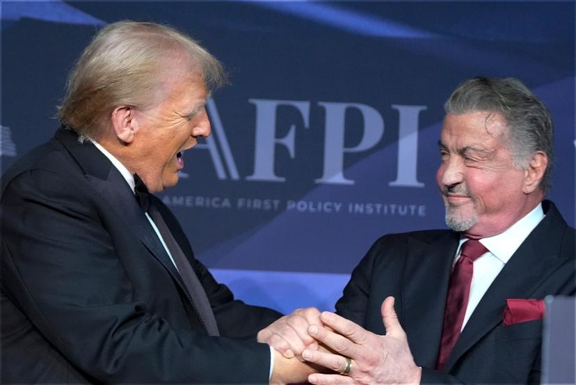 President-elect Donald Trump greets actor Sylvester Stallone during an America First Policy Institute gala 