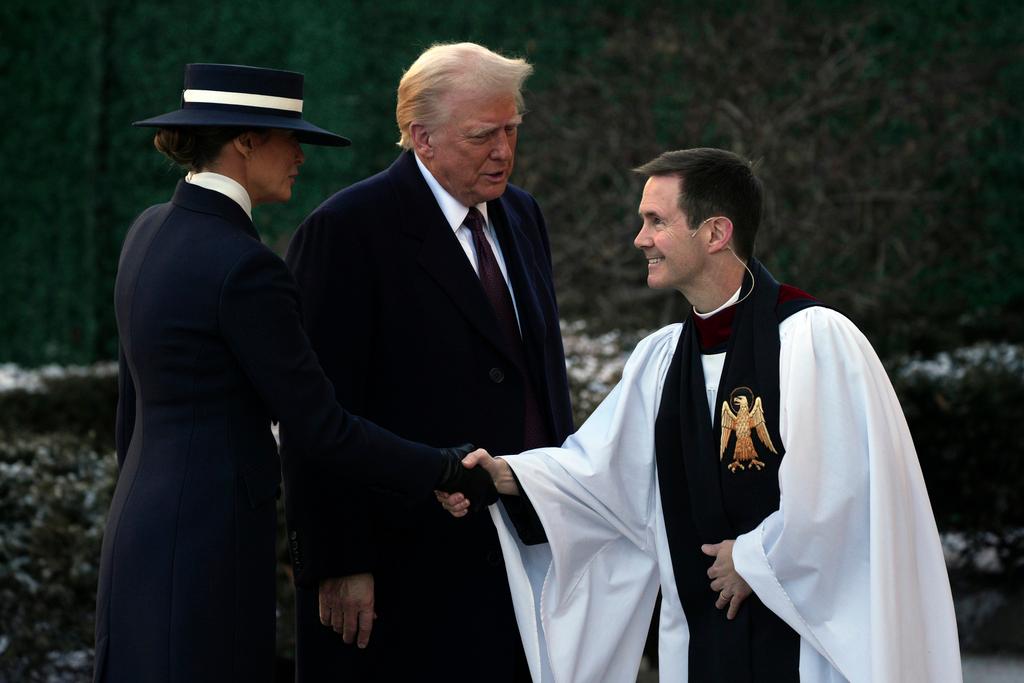 President-elect Donald Trump and his wife Melania are greeted as they arrive for church service at St. John's Episcopal Church across from the White House