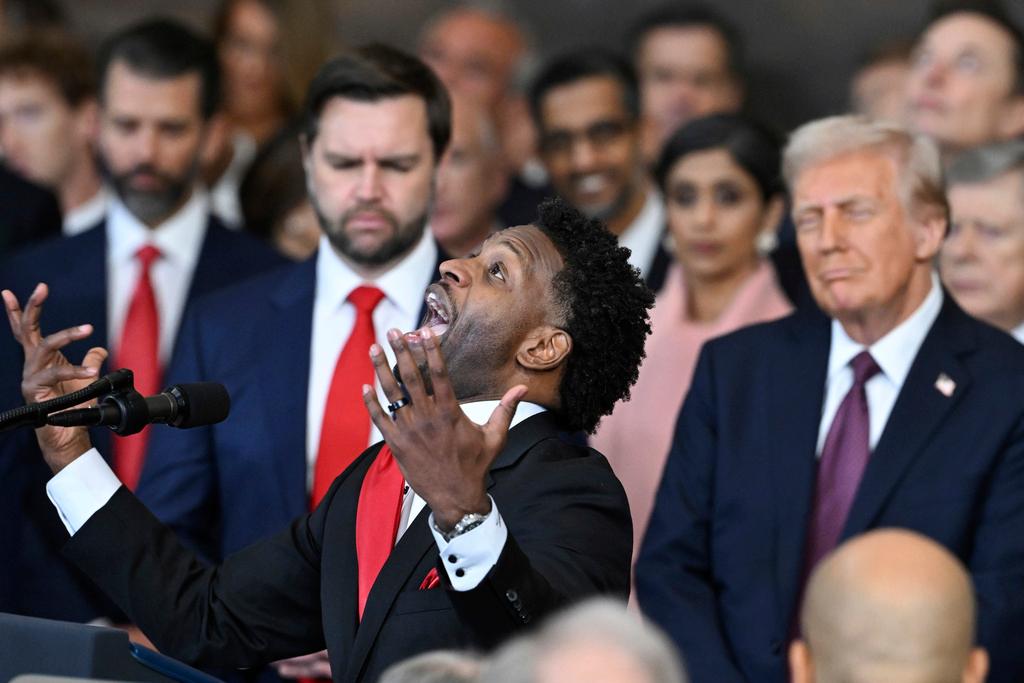 Pastor of 180 Church Lorenzo Sewell, delivers a benediction after President Donald Trump was sworn in during the 60th Presidential Inauguration in the Rotunda of the U.S. Capitol