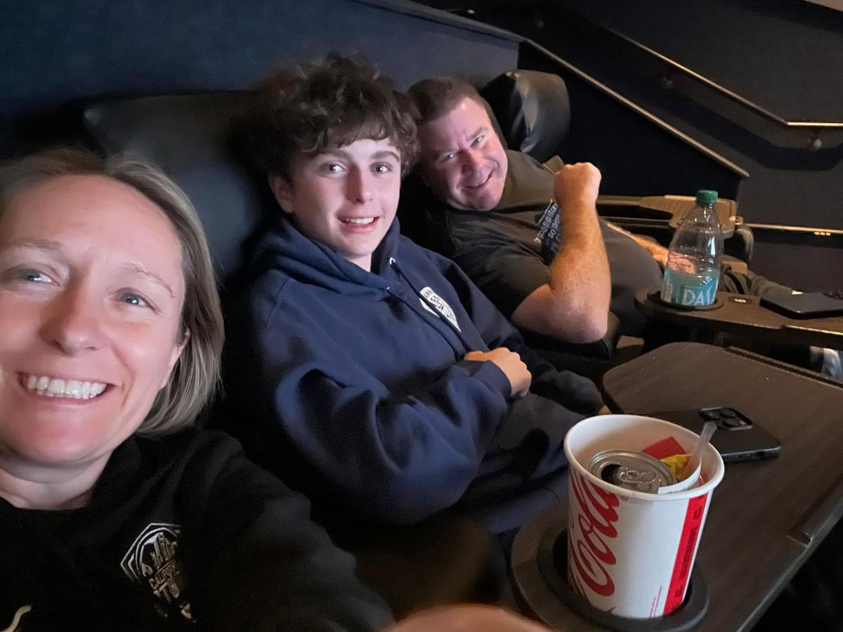 Mom, son and dad at the movies