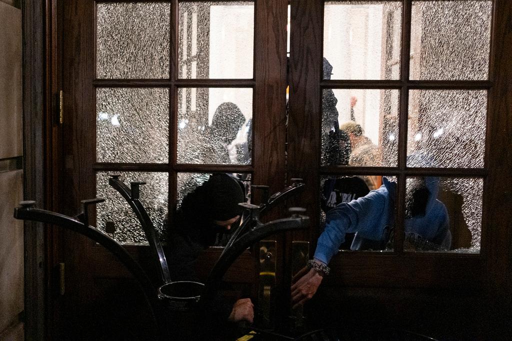 Students with the Gaza Solidarity Encampment block the entrance of Hamilton Hall at Columbia University after taking over it, April 30, 2024 in New York