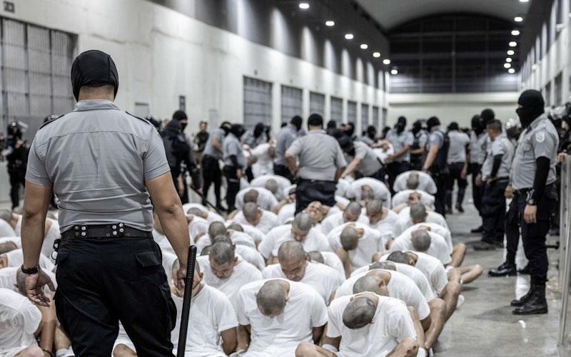  Prison guard transfers deportees from the U.S., suspected Venezuelan gang members, to the Terrorism Confinement Center in Tecoluca, El Salvador