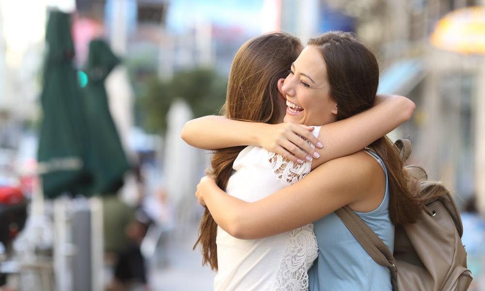 Two women hugging