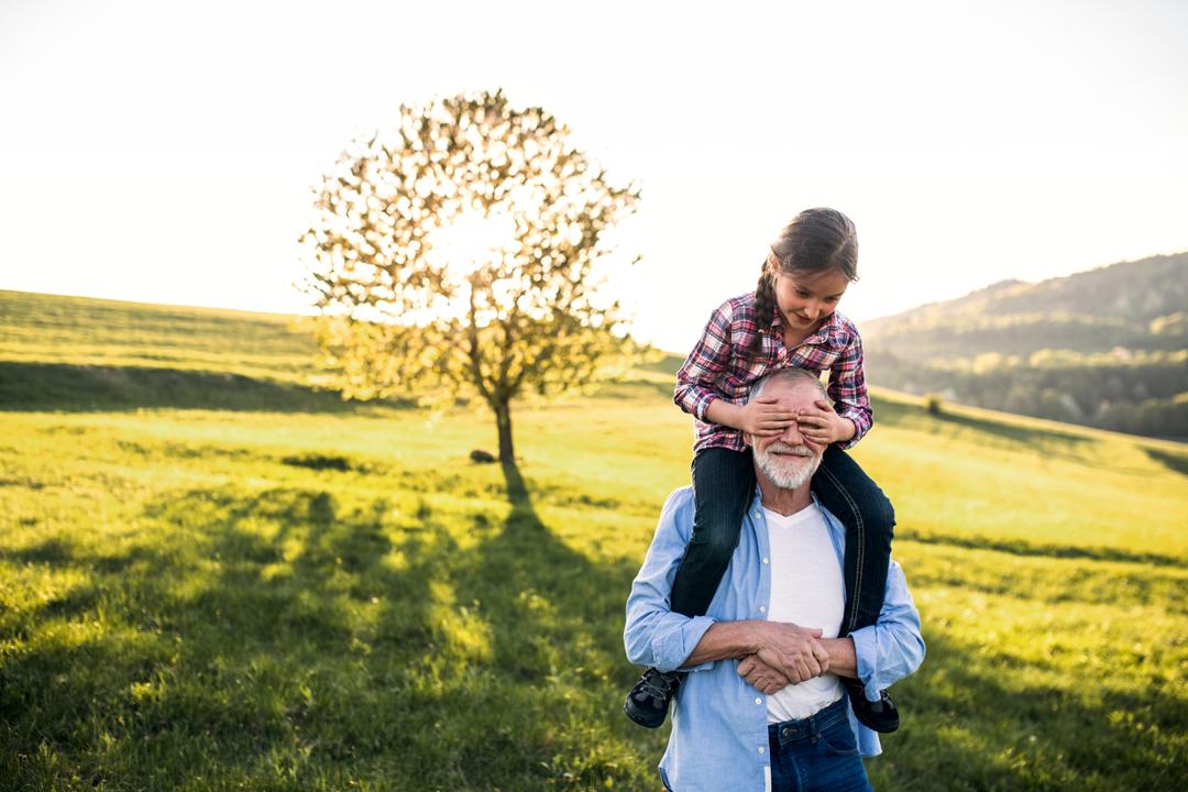 Granddaughter on Grandpa's Shoulders