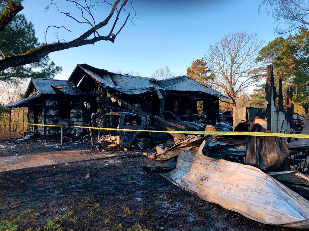 This photo provided by WLBT-TV shows damage to a house after a fatal fire in Clinton, Miss., on Saturday, Feb. 8, 2020. Several people have been killed in the house fire early Saturday in central Mississippi, authorities said.The fire happened around 12:30 a.m. in Clinton, which is outside Jackson, Clinton Fire Chief Jeff Blackledge told local news outlets. The victims, whose names were not immediately released, ranged in age from 1 to 33, Blackledge said.