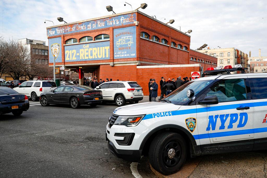 New York City police officers work the scene of a police involved shooting outside the 41st precinct Sunday, Feb. 9, 2020, in New York.