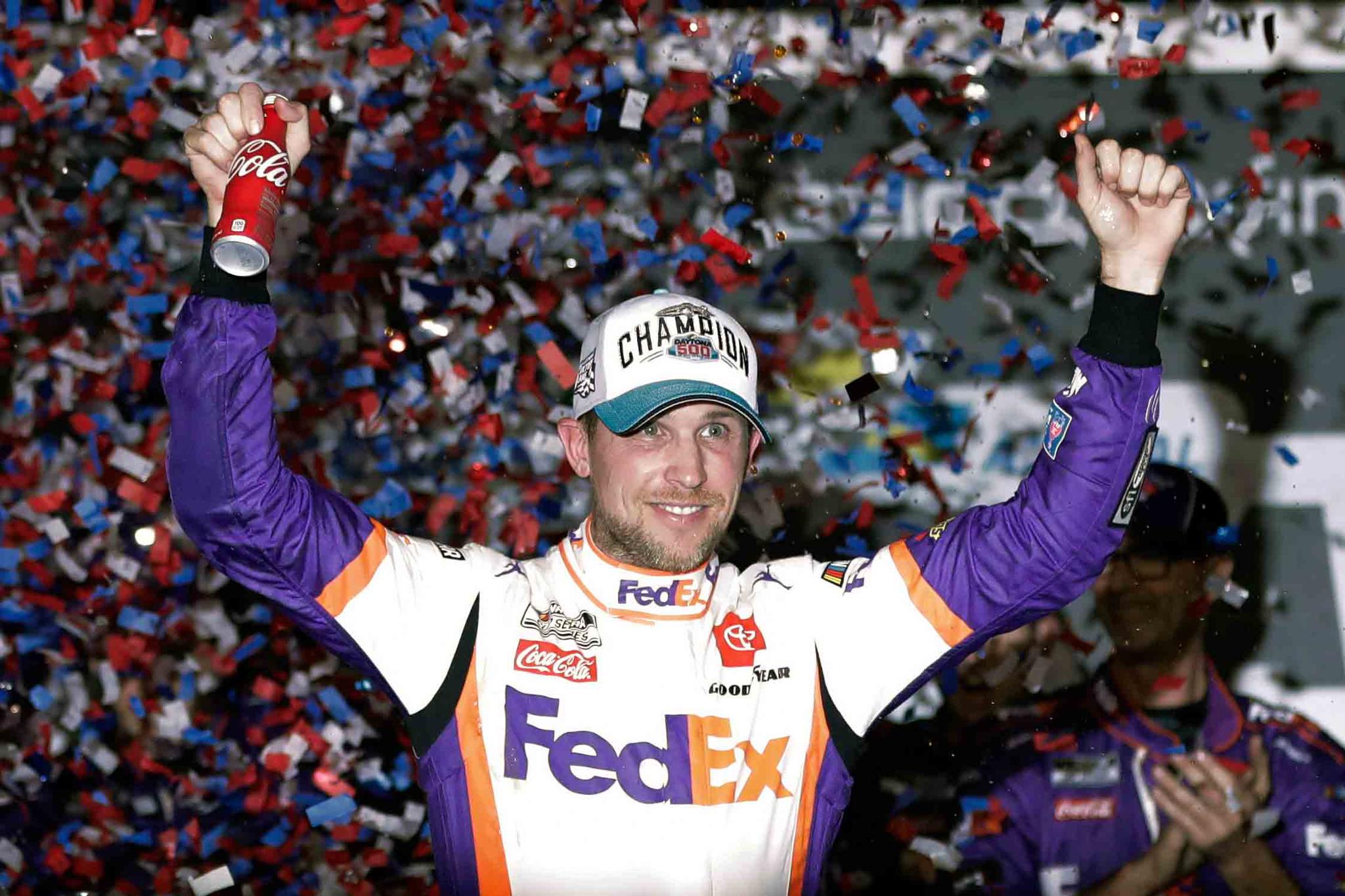 Denny Hamlin celebrates in Victory Lane after winning the NASCAR Daytona 500 auto race at Daytona International Speedway