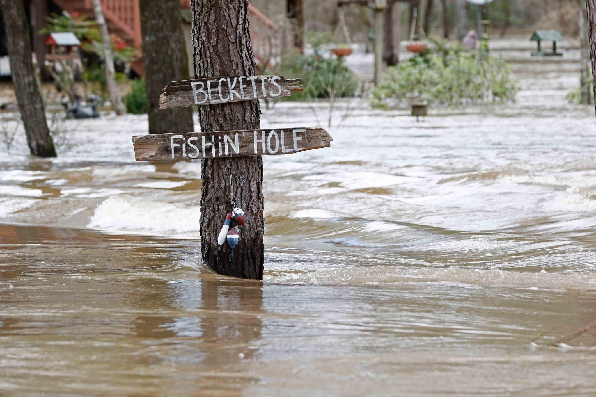 Water from the Pearl River floods Florence-Byram Road near Byram, Miss, Monday, Feb. 17, 2020