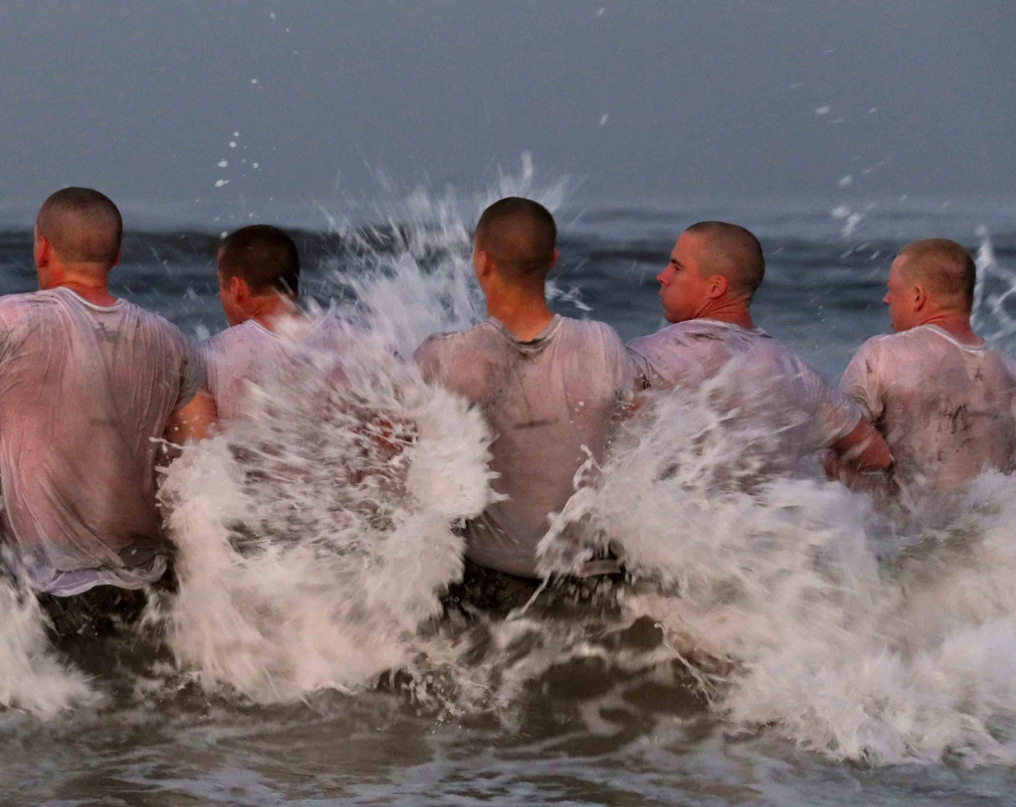 photo provided by the U.S. Navy shows SEAL candidates participating in "surf immersion" during Basic Underwater Demolition training at the Naval Special Warfare (NSW) Center in Coronado, California