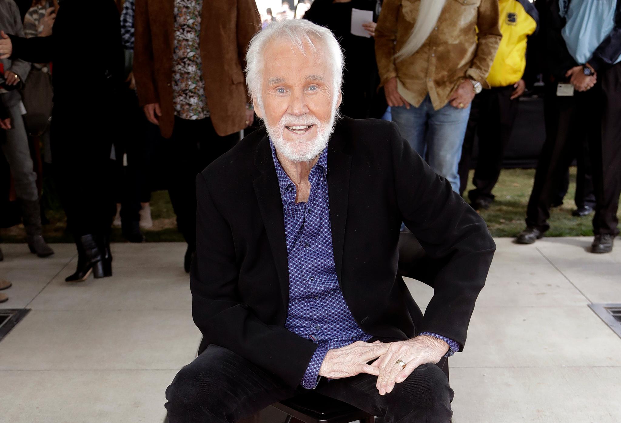 Kenny Rogers in front of walk of fame