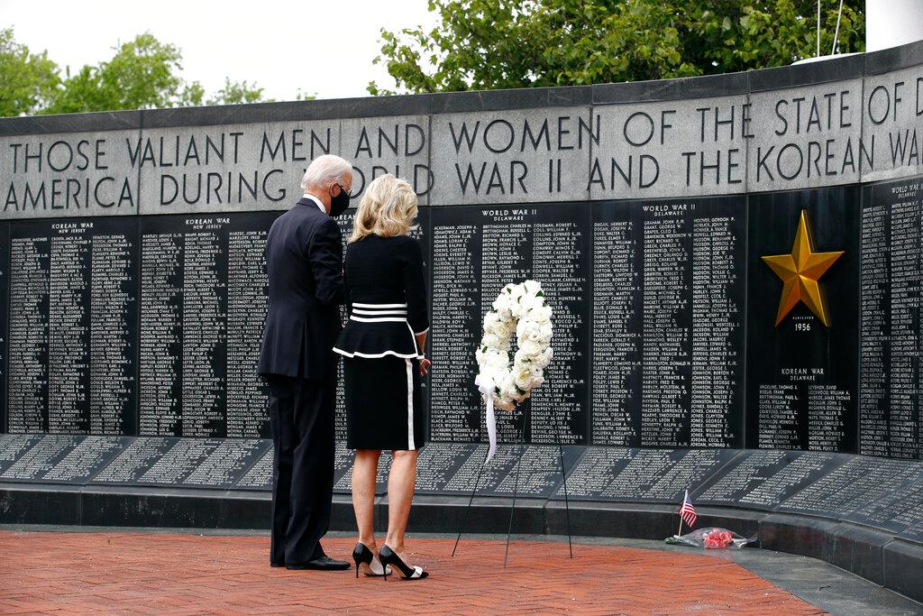 Democratic presidential candidate, former Vice President Joe Biden and Jill Biden pause afer placing a wreath at the Delaware Memorial Bridge Veterans Memorial Park in New Castle, Del.