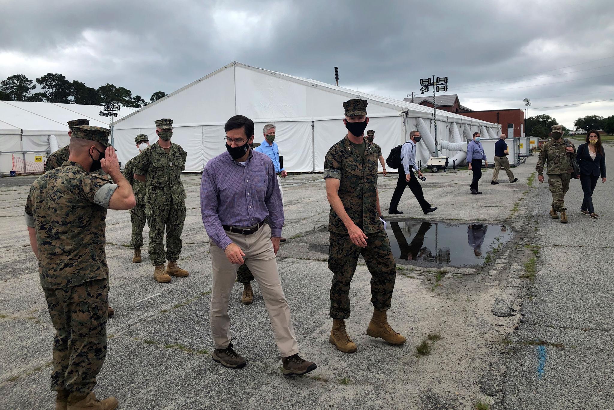 Marine Maj. Gen. James Glynn gives Defense Secretary Mark Esper a tour