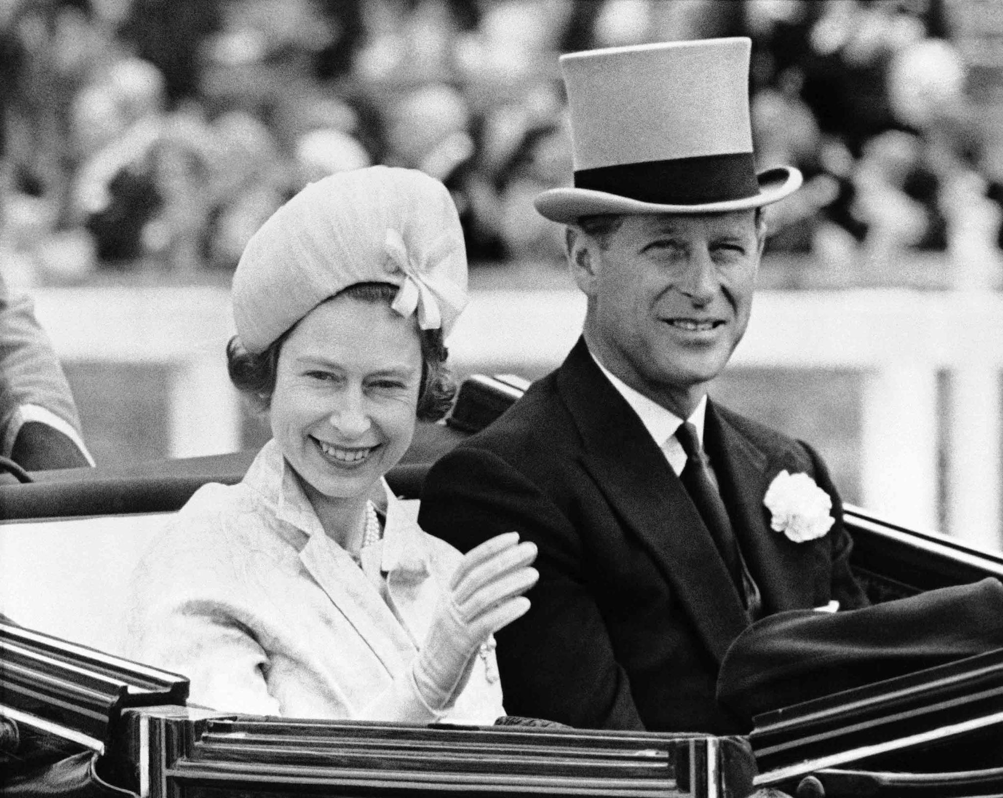 Britain's Prince Philip and his wife Queen Elizabeth II arrive at Royal Ascot race meeting, England.