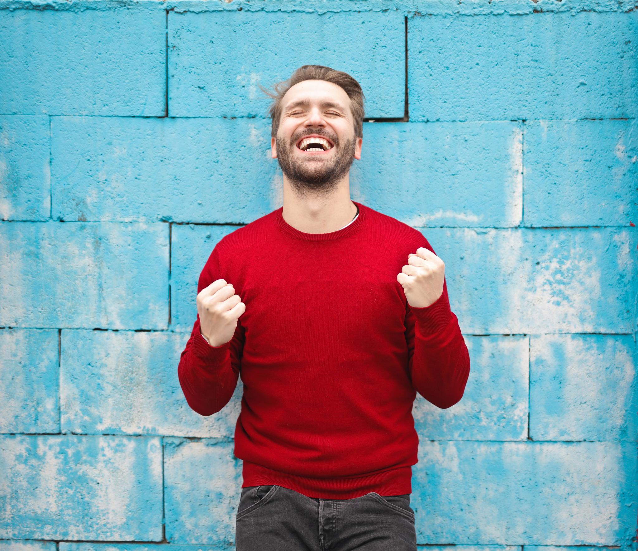 Man in red shirt, smiling, happy, joyful